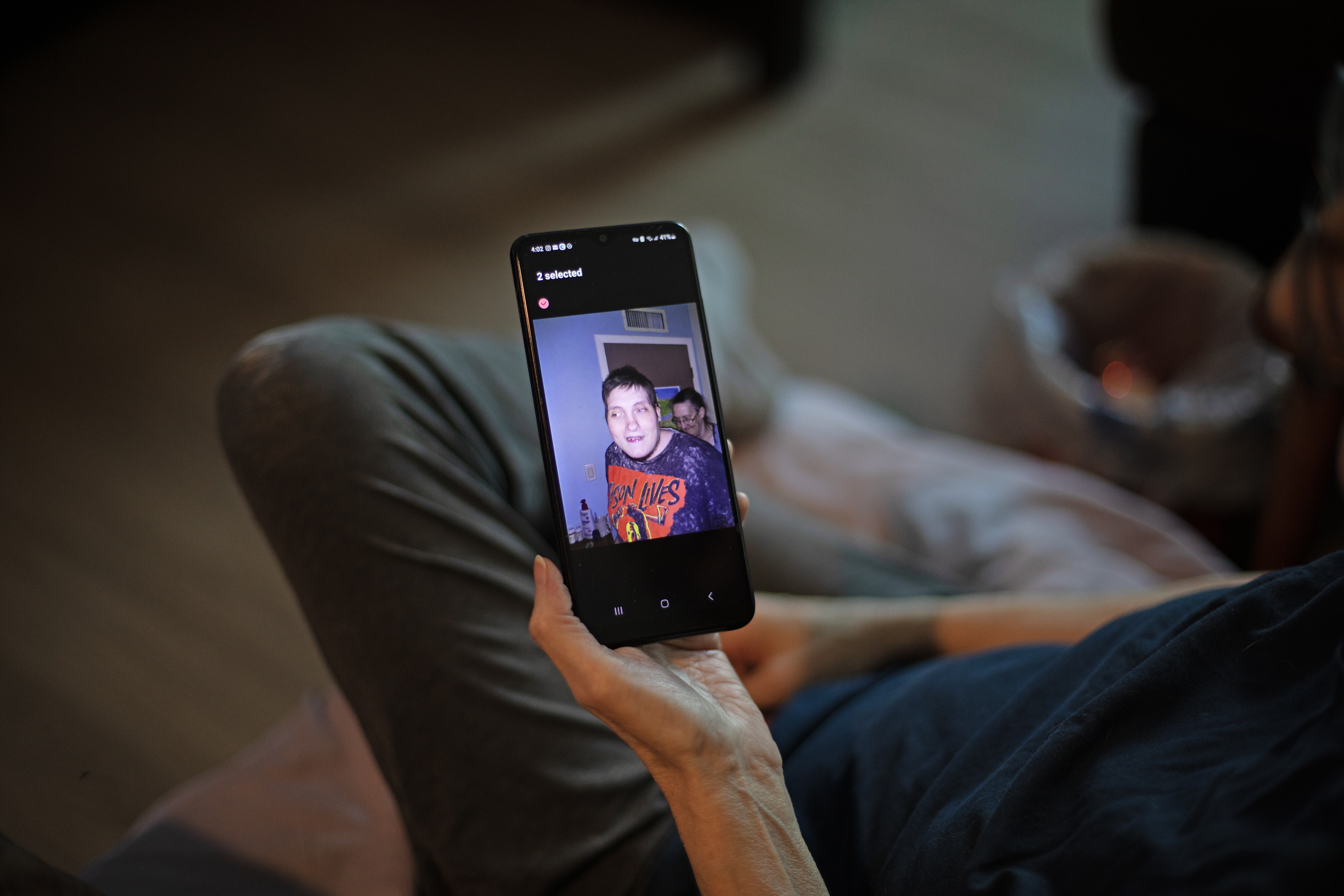 Debbie Willson holds a photo of her son, Adam Willson, who died in June 2024. Debbie is sure his death was influenced by heat, but his death certificate doesn
